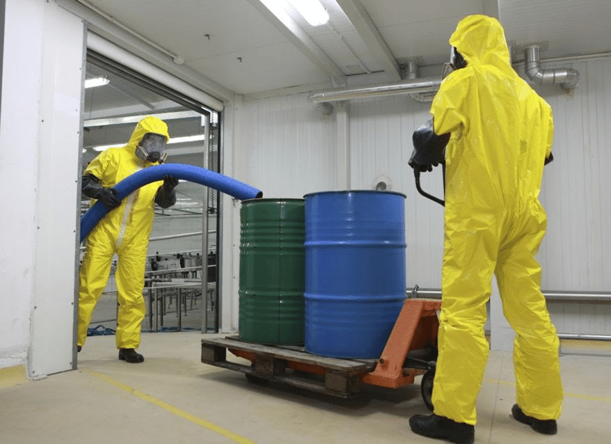 Men in yellow suits getting rid of hazardous material. 