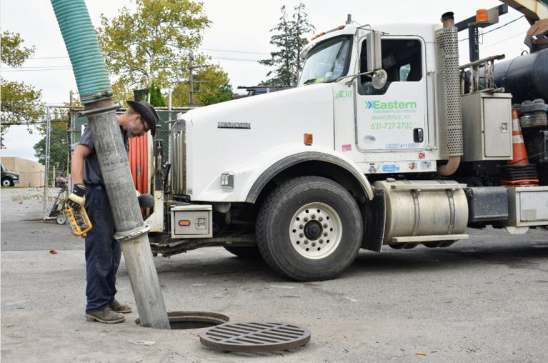 Vac truck cleaning storm drain
